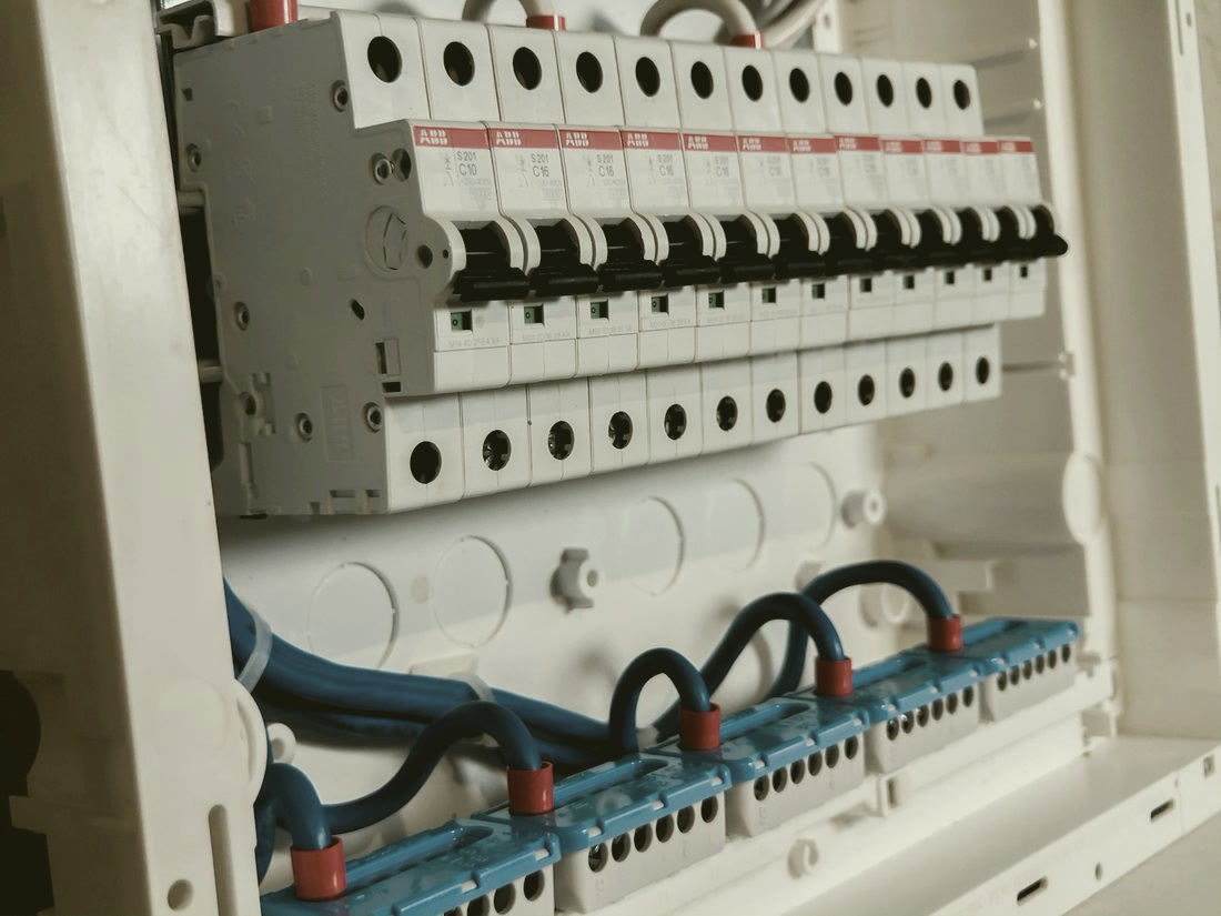 A distribution board with rows of circuit breakers